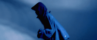 A Person Wearing A Blue Jacket With A Hood On GIF