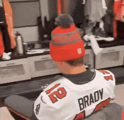 A Person Wearing A Brady Jersey And A Red Hat GIF
