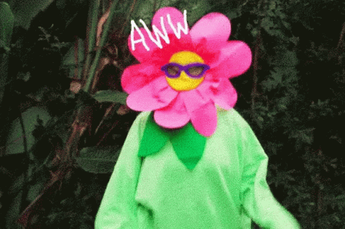 A Person Wearing A Flower Costume With The Word Aww Written Above It GIF