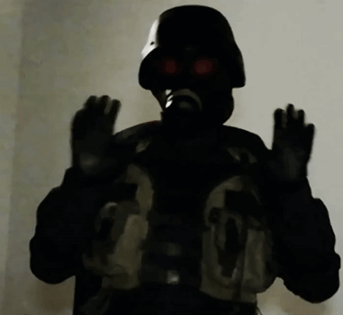 A Person Wearing A Gas Mask Has The Number 36 On Their Chest GIF