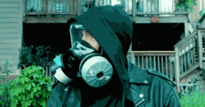 A Person Wearing A Gas Mask With A Hood On GIF
