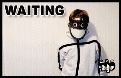 A Person Wearing A Gas Mask With The Word Waiting Behind Them GIF