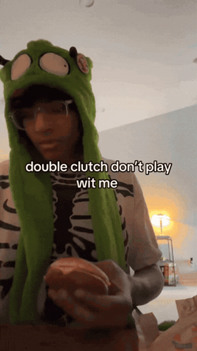 A Person Wearing A Green Hat Says Double Clutch Don T Play Wit Me GIF