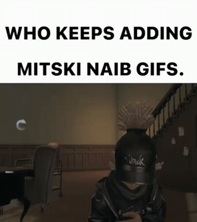 A Person Wearing A Hat With The Word Jack On It Is Sitting In A Room . GIF