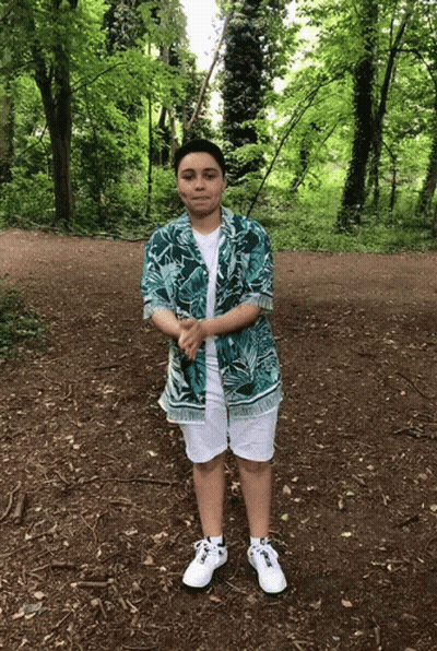 A Person Wearing A Hawaiian Shirt And White Shorts GIF