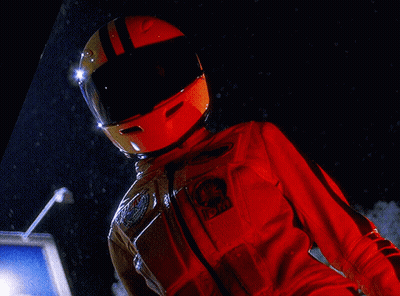 A Person Wearing A Helmet And A Red Jacket With A Patch That Says Nasa On It GIF