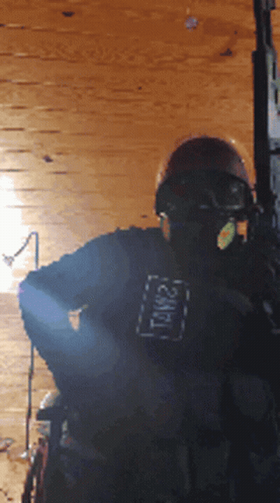 A Person Wearing A Helmet And A Shirt That Says Tnw21 GIF
