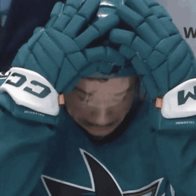 A Person Wearing A Helmet And Gloves That Say Ccm On Them GIF