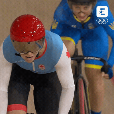 A Person Wearing A Helmet And Goggles Is Riding A Bike Next To Another Person GIF