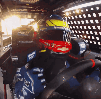A Person Wearing A Helmet That Says Hendrick Racing On It GIF