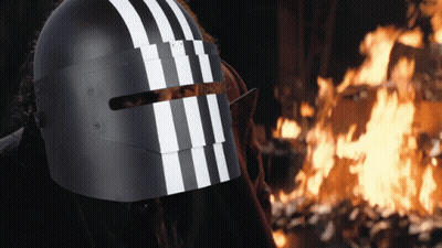 A Person Wearing A Helmet With White Stripes On It GIF