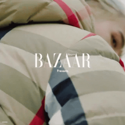 A Person Wearing A Jacket With The Word Bazaar Written On It GIF