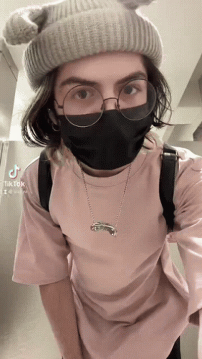 A Person Wearing A Mask And Glasses Has Tiktok Written On The Bottom Right Corner GIF
