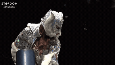A Person Wearing A Mask And Holding A Sword With The Word Stardom Written On The Bottom GIF