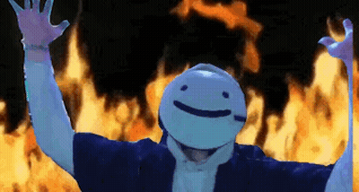 A Person Wearing A Mask With A Smiley Face Is Standing In Front Of A Fire . GIF
