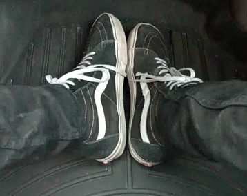 A Person Wearing A Pair Of Black And White Sneakers GIF