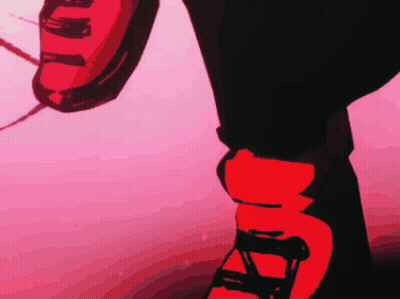 A Person Wearing A Pair Of Red And Black Shoes With The Letter A On Them GIF