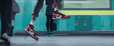 A Person Wearing A Pair Of Red And White Nike Air Jordans GIF