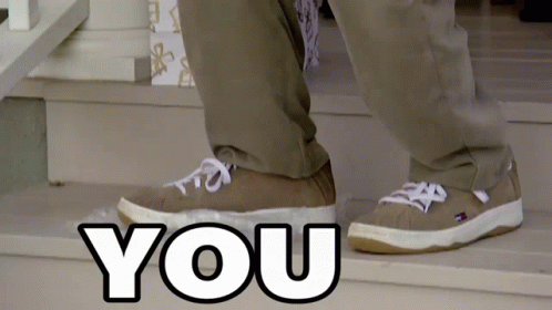 A Person Wearing A Pair Of Tommy Hilfiger Shoes Is Walking Down A Set Of Stairs GIF