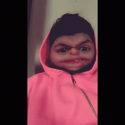 A Person Wearing A Pink Hoodie With A Zipper On The Front GIF