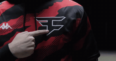 A Person Wearing A Red And Black Shirt With The Letter F On The Chest GIF