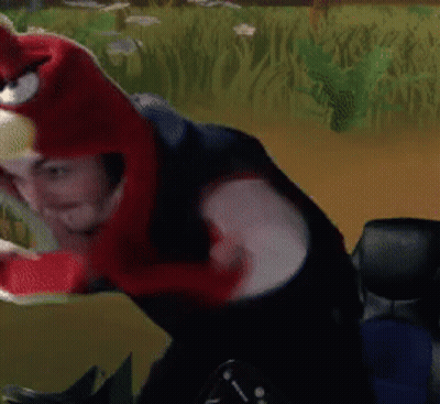 A Person Wearing A Red And White Angry Bird Costume GIF