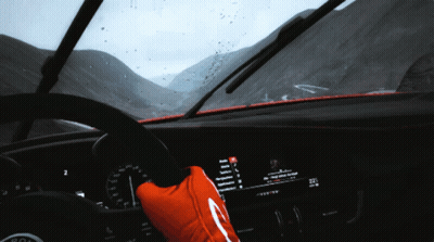 A Person Wearing A Red Glove Driving A Car GIF