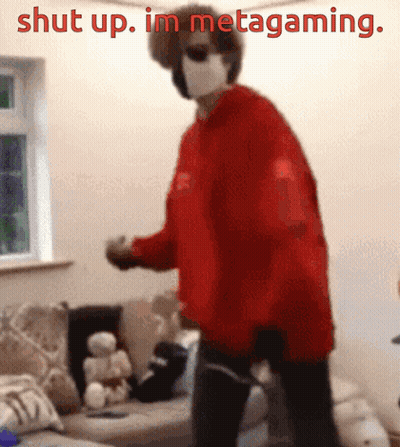 A Person Wearing A Red Sweater And A Mask Is Standing In A Living Room With The Words Shut Up . Im Metagaming . GIF