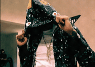 A Person Wearing A Shark Costume With A Hood GIF