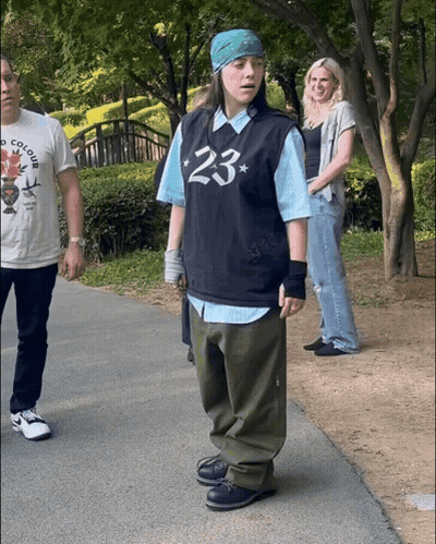 A Person Wearing A Shirt That Says 23 On It GIF