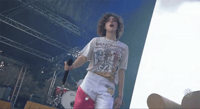 A Person Wearing A Shirt That Says Lollipops On It GIF