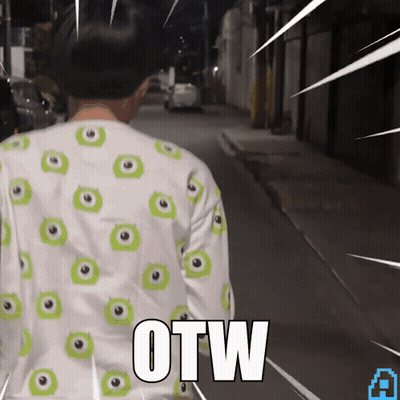 A Person Wearing A Shirt With Green Eyes And The Word Otw On The Back GIF