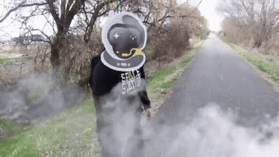 A Person Wearing A Space Station Hoodie Is Standing On A Road GIF