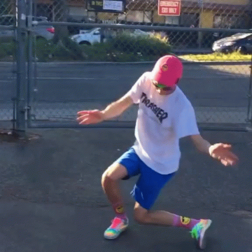A Person Wearing A Thrasher Shirt And Blue Shorts Is Dancing GIF