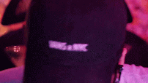 A Person Wearing A Vans X Nyc Hat And Headphones GIF
