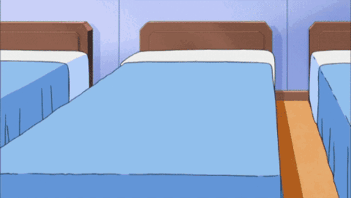 A Person Wearing A Watch With The Number 8 On It Is Standing Next To A Bed GIF