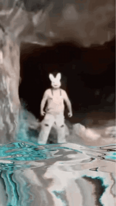 A Person Wearing A White Bunny Costume Is Standing In The Water GIF