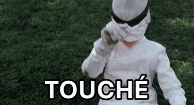A Person Wearing A White Costume With The Word Touche Written On It GIF
