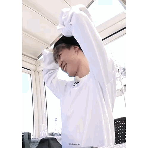 A Person Wearing A White Shirt With A Black Beanie On Their Head Sticker