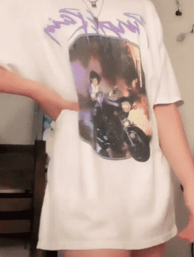 A Person Wearing A White T-Shirt With A Picture Of A Man On A Motorcycle On It GIF