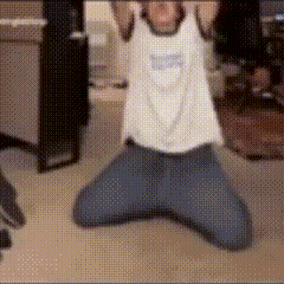 A Person Wearing A White Tank Top That Says ' Snoopy ' On It GIF