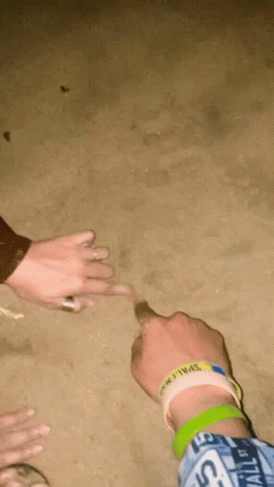 A Person Wearing A Wristband That Says " Space " On It GIF