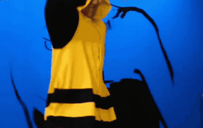A Person Wearing A Yellow And Black Striped Shirt GIF