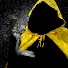 A Person Wearing A Yellow Cape And A Black Cape GIF