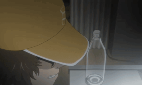 A Person Wearing A Yellow Hat With The Letter U On It GIF