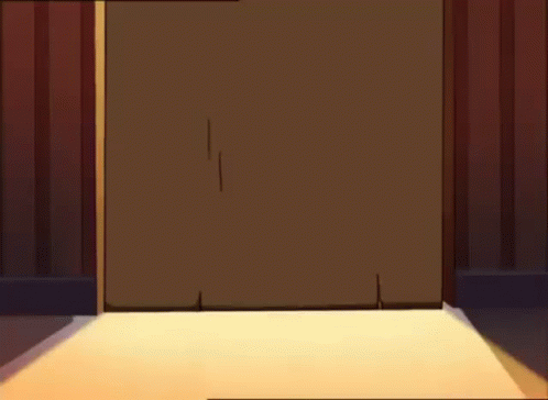 A Person Wearing Bunny Slippers Is Standing In A Doorway . GIF