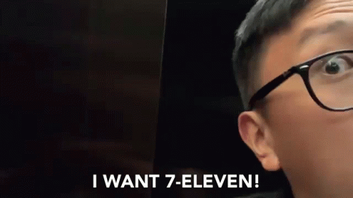 A Person Wearing Glasses Is Saying I Want 7 Eleven GIF