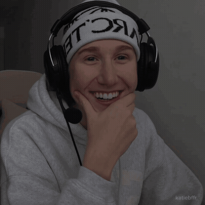 A Person Wearing Headphones And A Beanie That Says ' Nc Le ' On It GIF