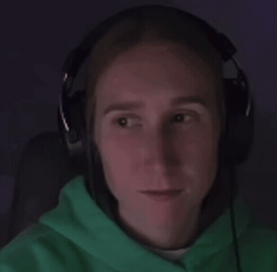 A Person Wearing Headphones And A Green Hoodie GIF