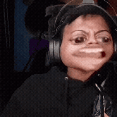 a person wearing headphones making a funny face with their mouth open